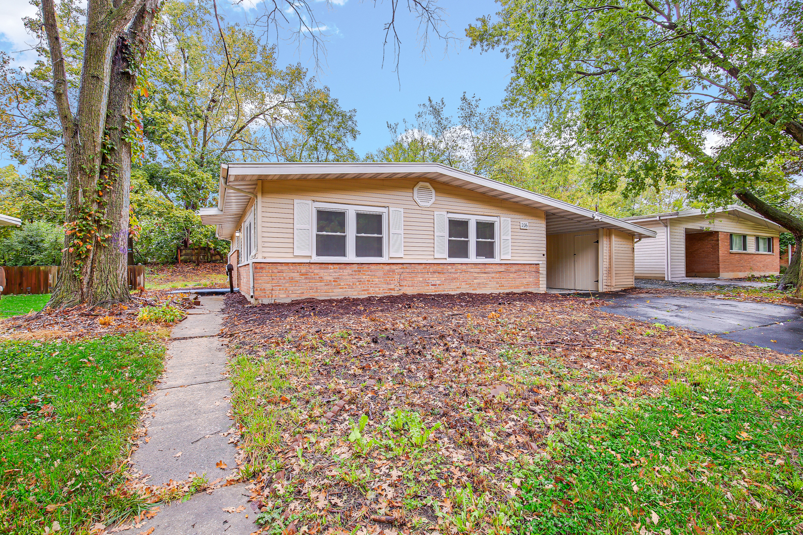 front view of a house with a yard