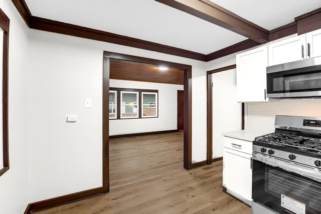 a kitchen with a stove and a microwave