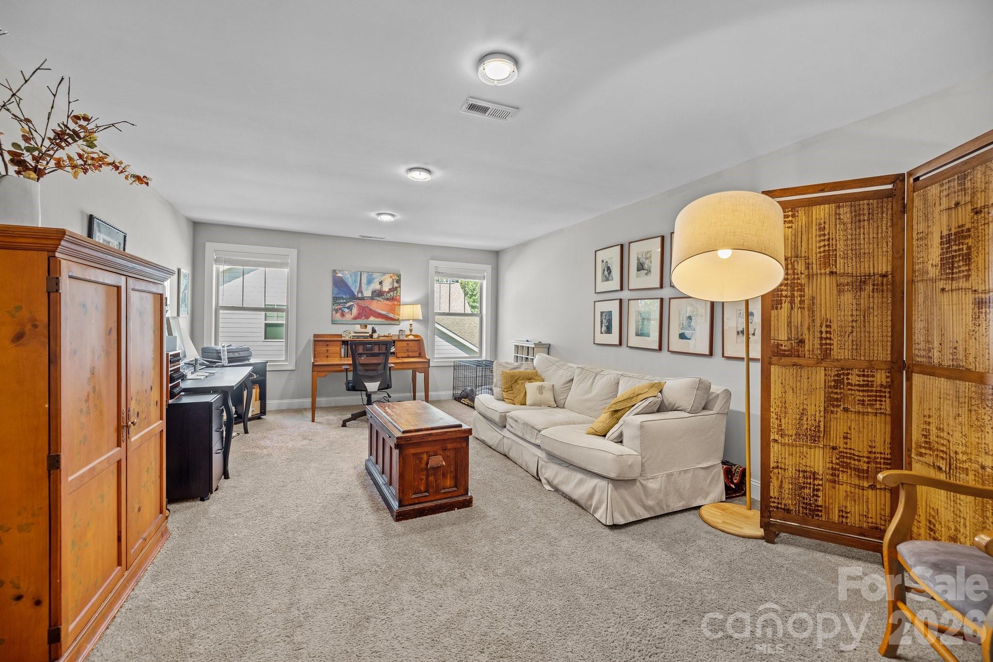 4697 Rinaldo Road York, SC 29745 - Photo 24 of 37 a living room with furniture a chandelier and a flat screen tv