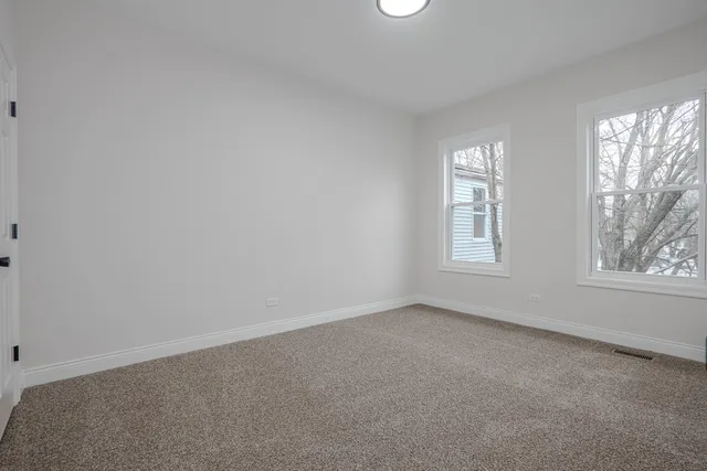 an empty room with windows