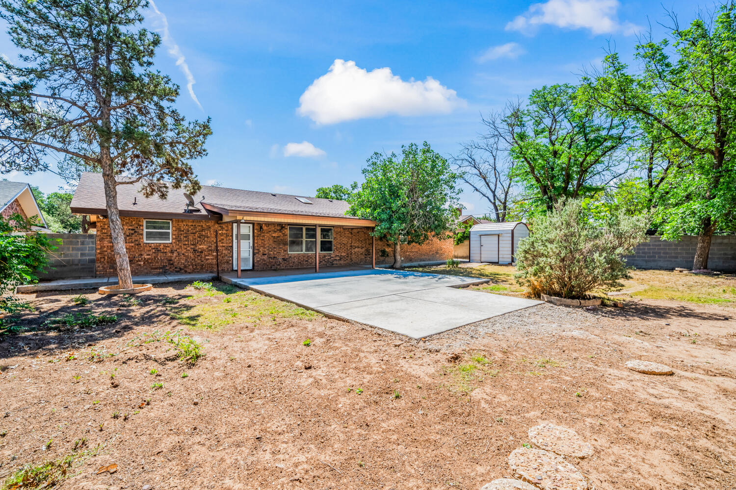 2028 Rice Drive Levelland, TX 79336 - Photo 22 of 25 a house with trees in front of it
