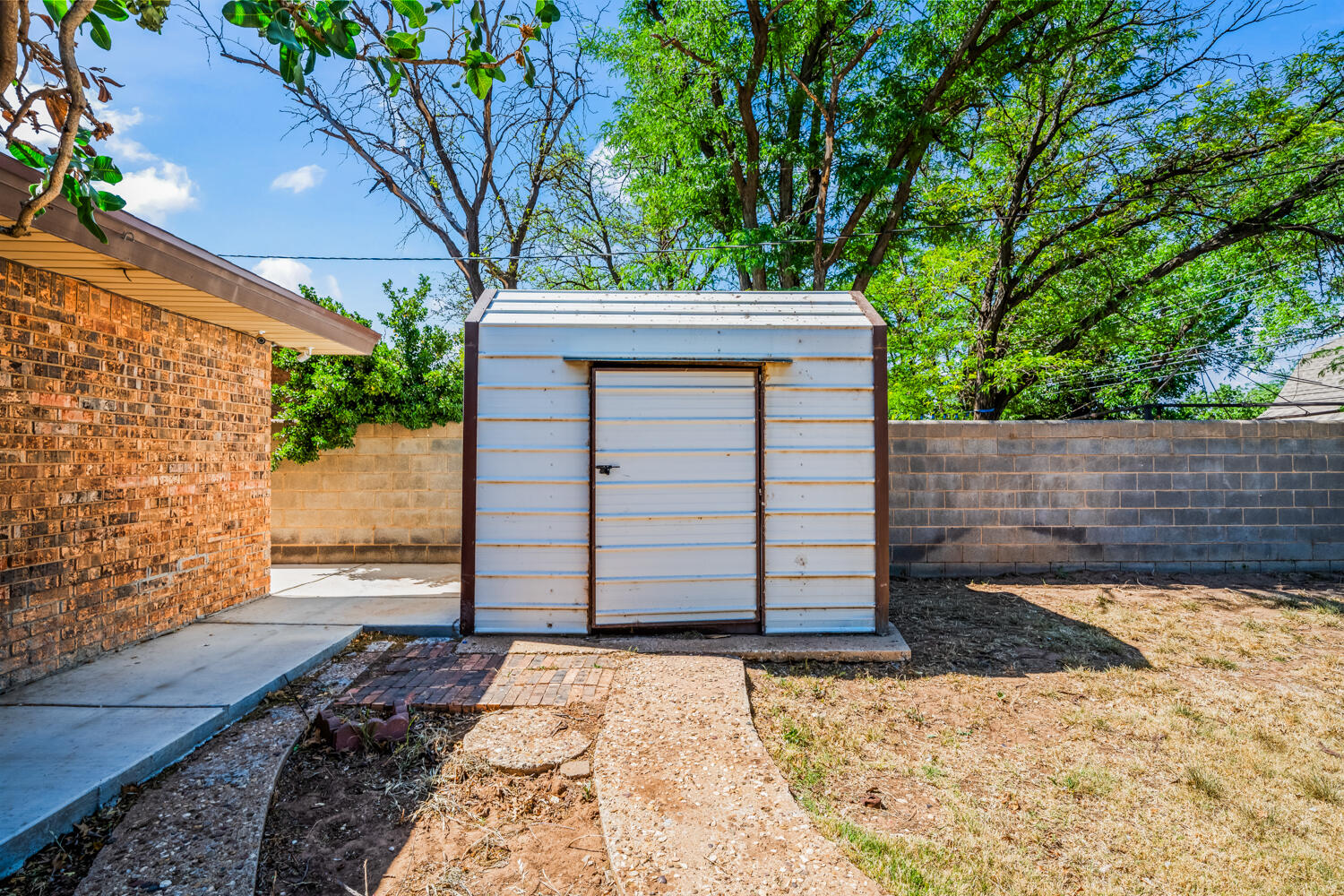 2028 Rice Drive Levelland, TX 79336 - Photo 23 of 25 a front view of a house with a yard