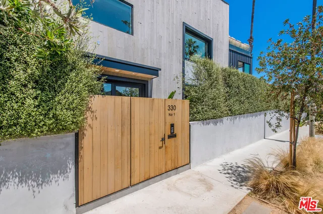 a view of a house with a tree
