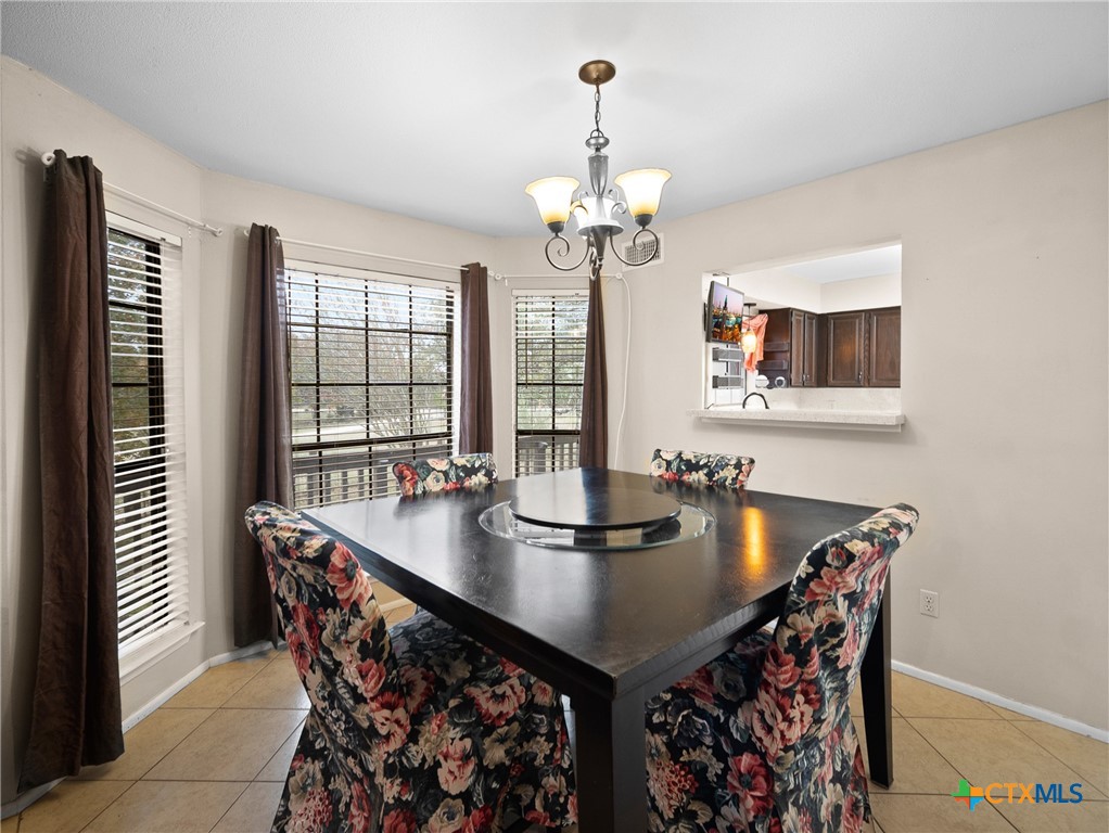 140 Engelmann Lane Seguin, TX 78155 - Photo 23 of 38 a view of a dining room with furniture and chandelier