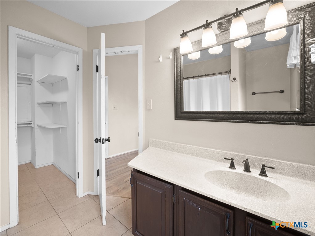 140 Engelmann Lane Seguin, TX 78155 - Photo 36 of 38 a bathroom with a double vanity sink mirror and