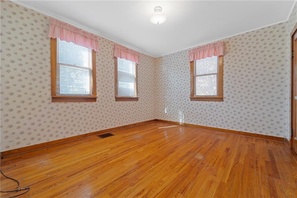 338 Brownlee Road Eighty Four, PA 15330 - Photo 12 of 29 a view of an empty room with wooden floor and a window