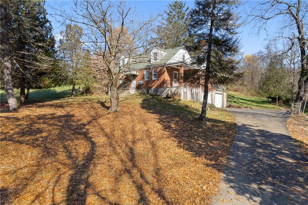 338 Brownlee Road Eighty Four, PA 15330 - Photo 2 of 29 a view of dirt yard with a tree