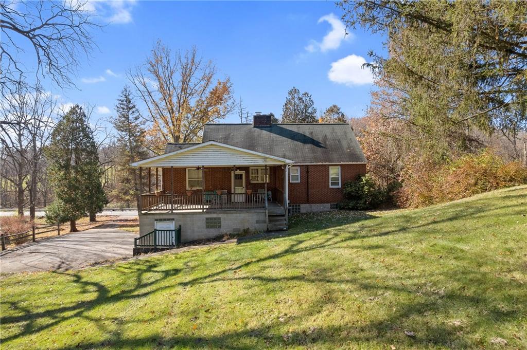 338 Brownlee Road Eighty Four, PA 15330 - Photo 23 of 29 a front view of a house with a yard