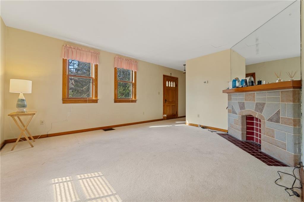 338 Brownlee Road Eighty Four, PA 15330 - Photo 5 of 29 a view of an empty room with a fireplace and a window