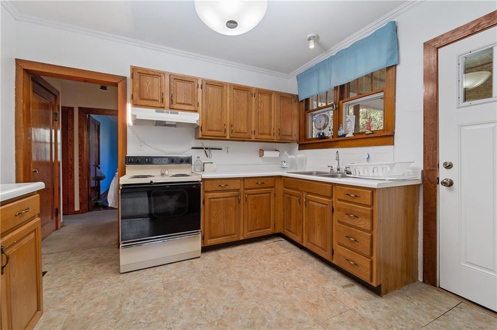 338 Brownlee Road Eighty Four, PA 15330 - Photo 8 of 29 a kitchen with a stove microwave and sink
