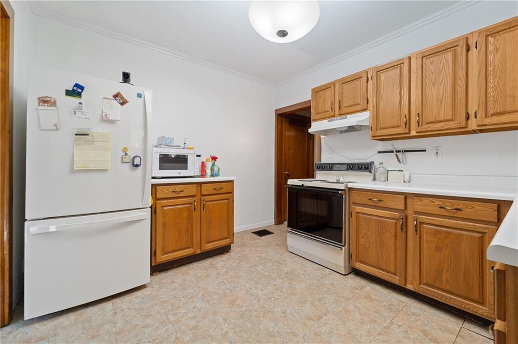338 Brownlee Road Eighty Four, PA 15330 - Photo 9 of 29 a kitchen with stainless steel appliances granite countertop a refrigerator sink and cabinets