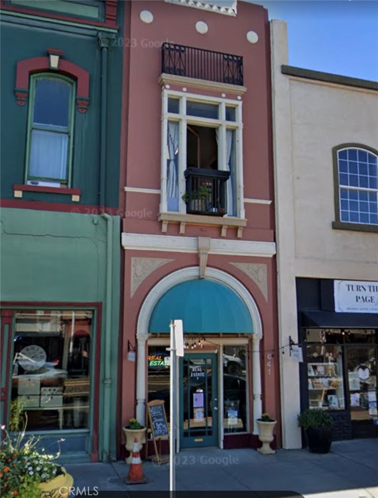a view of building with a lot of windows and a fireplace