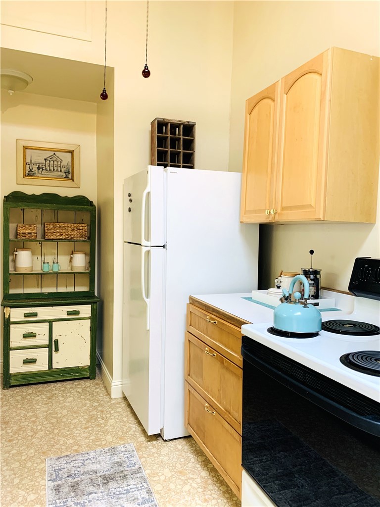 641 Main Street Red Bluff, CA 96080 - Photo 16 of 24 a kitchen with stainless steel appliances granite countertop a refrigerator and a stove