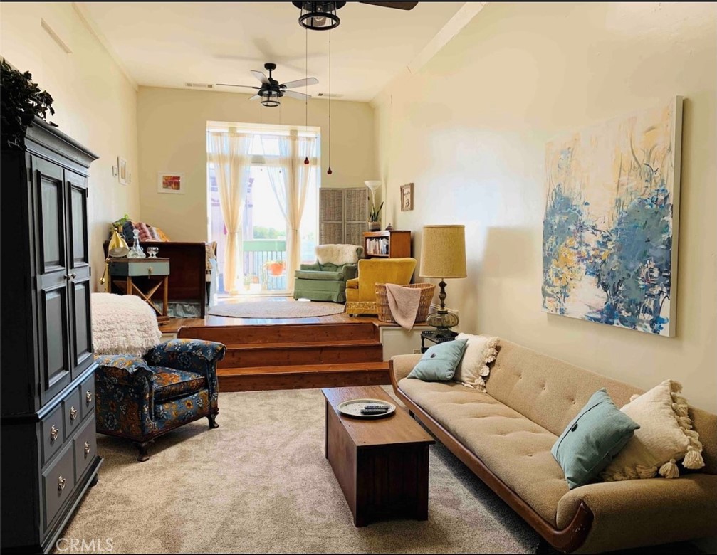 641 Main Street Red Bluff, CA 96080 - Photo 20 of 24 a living room with furniture and a chandelier