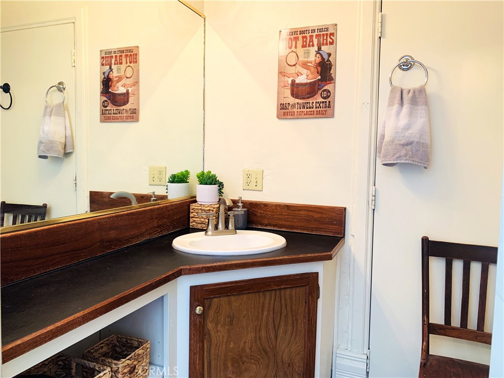 641 Main Street Red Bluff, CA 96080 - Photo 23 of 24 a bathroom with a sink and a mirror