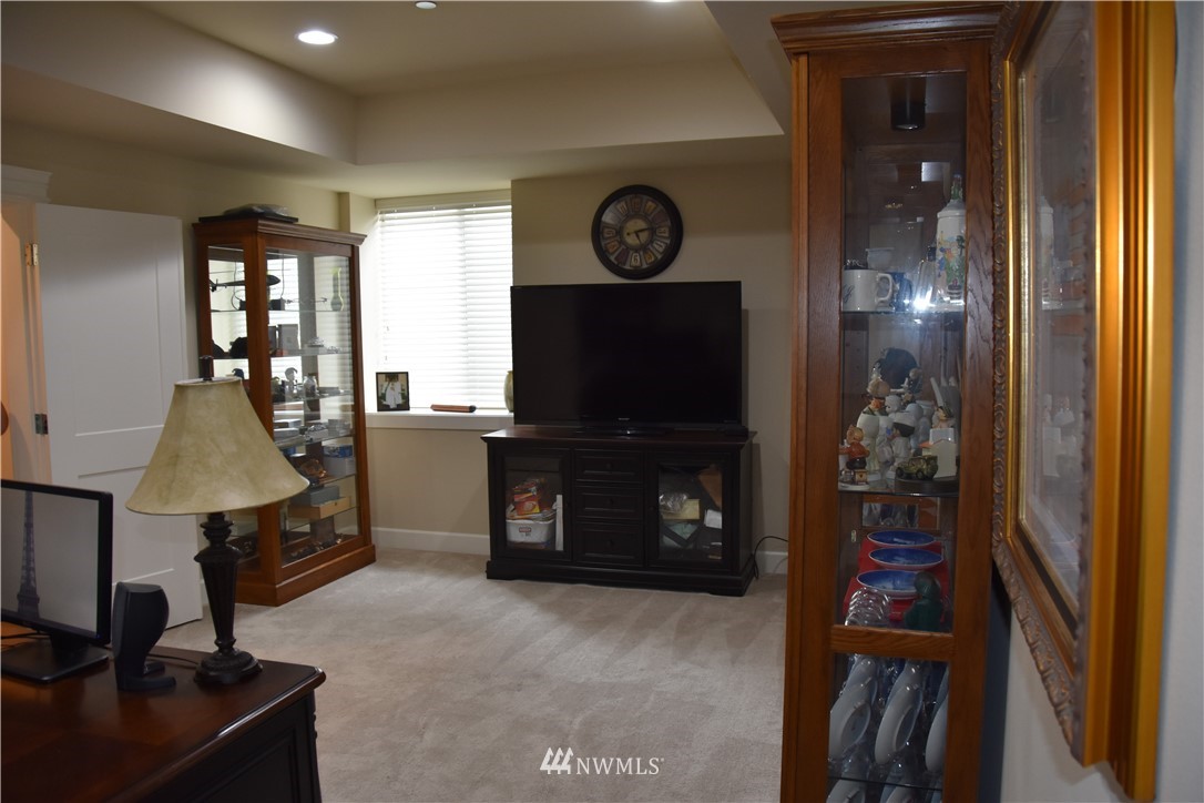 906 231st Street Southeast Bothell, WA 98021 - Photo 14 of 15 a living room with furniture and a flat screen tv