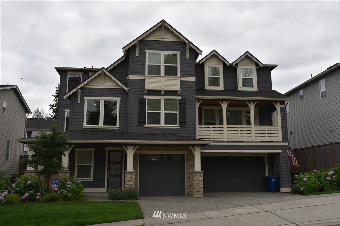 906 231st Street Southeast Bothell, WA 98021 - Photo 2 of 15 a front view of a house with garden