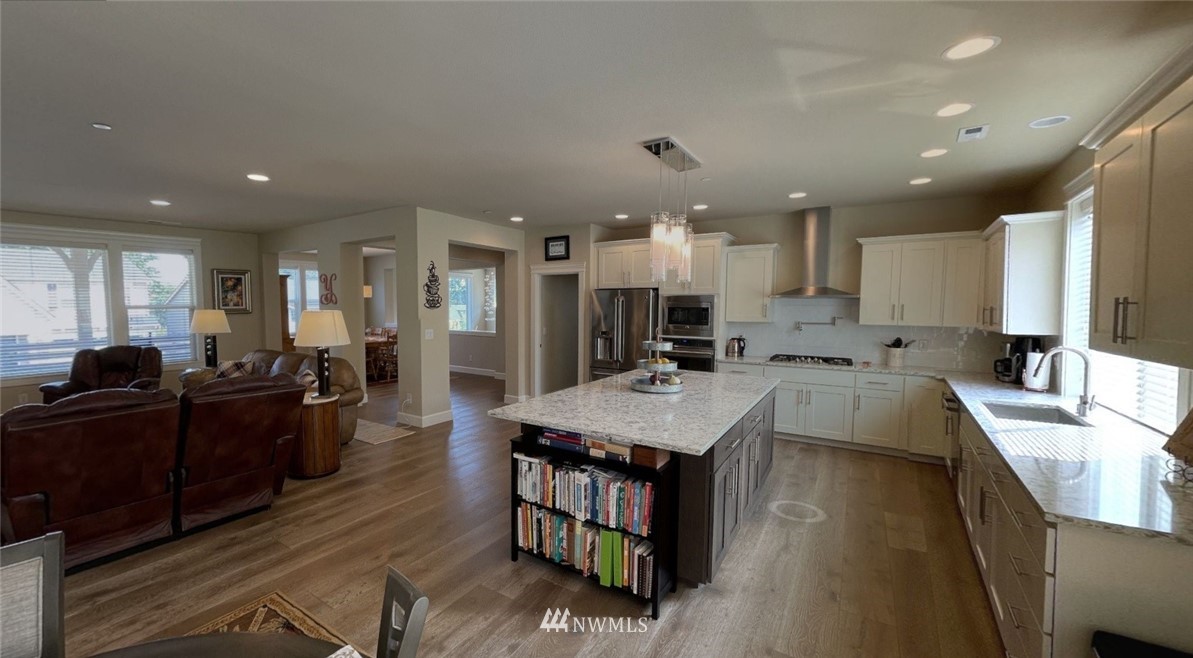 906 231st Street Southeast Bothell, WA 98021 - Photo 3 of 15 a large kitchen with lots of counter space a sink and a refrigerator