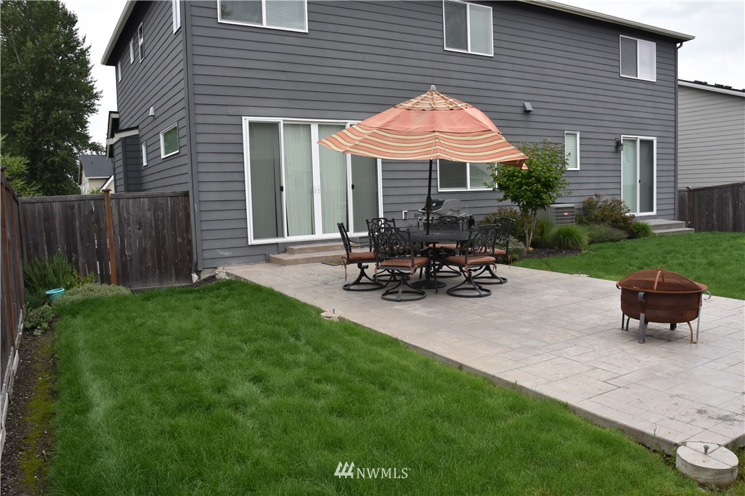 906 231st Street Southeast Bothell, WA 98021 - Photo 9 of 15 a front view of a house with a garden and patio