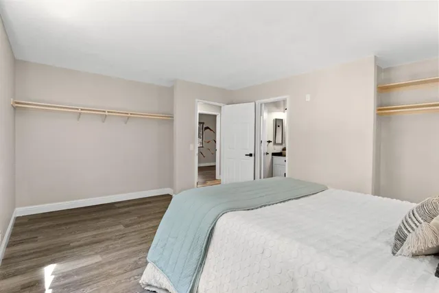 a large white bed in a white room