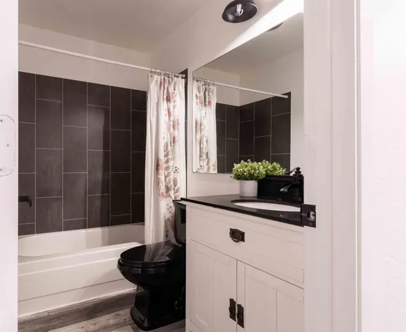 a bathroom with a tub and a shower