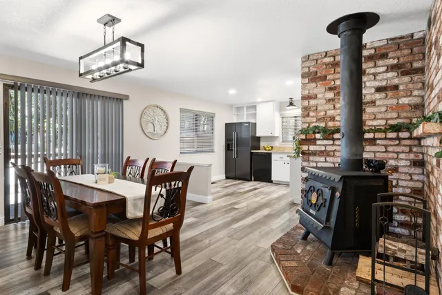 a view of a dining room with furniture window and wooden floor