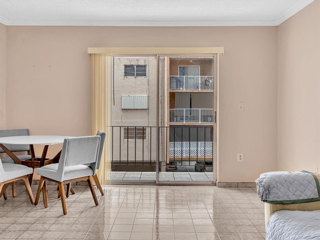 1075 West 68th Street, Unit 203 Hialeah, FL 33014 - Photo 13 of 41 a workspace with furniture and a window