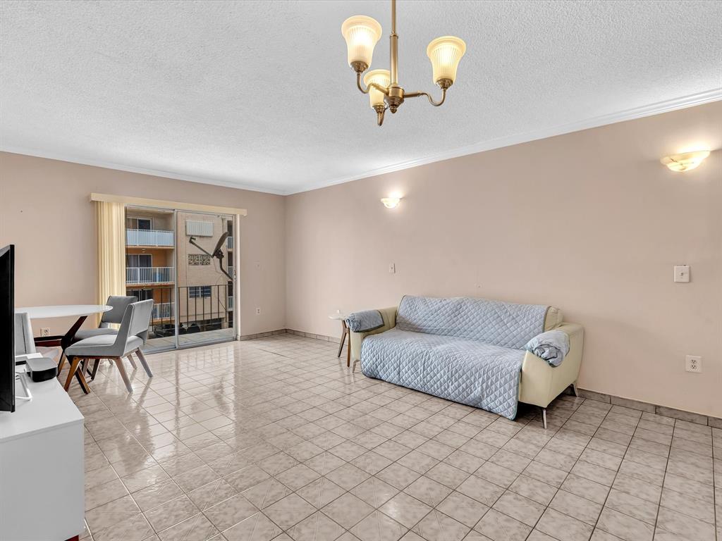 1075 West 68th Street, Unit 203 Hialeah, FL 33014 - Photo 14 of 41 a living room with furniture