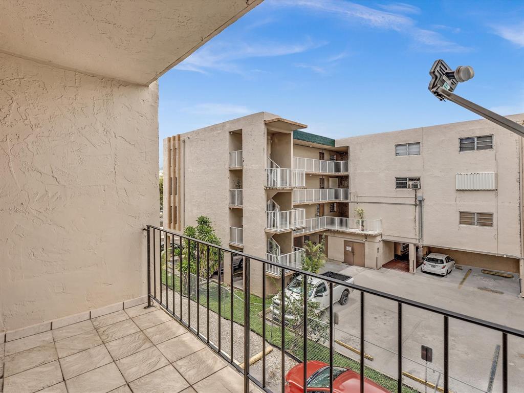1075 West 68th Street, Unit 203 Hialeah, FL 33014 - Photo 21 of 41 a view of balcony with a potted plant