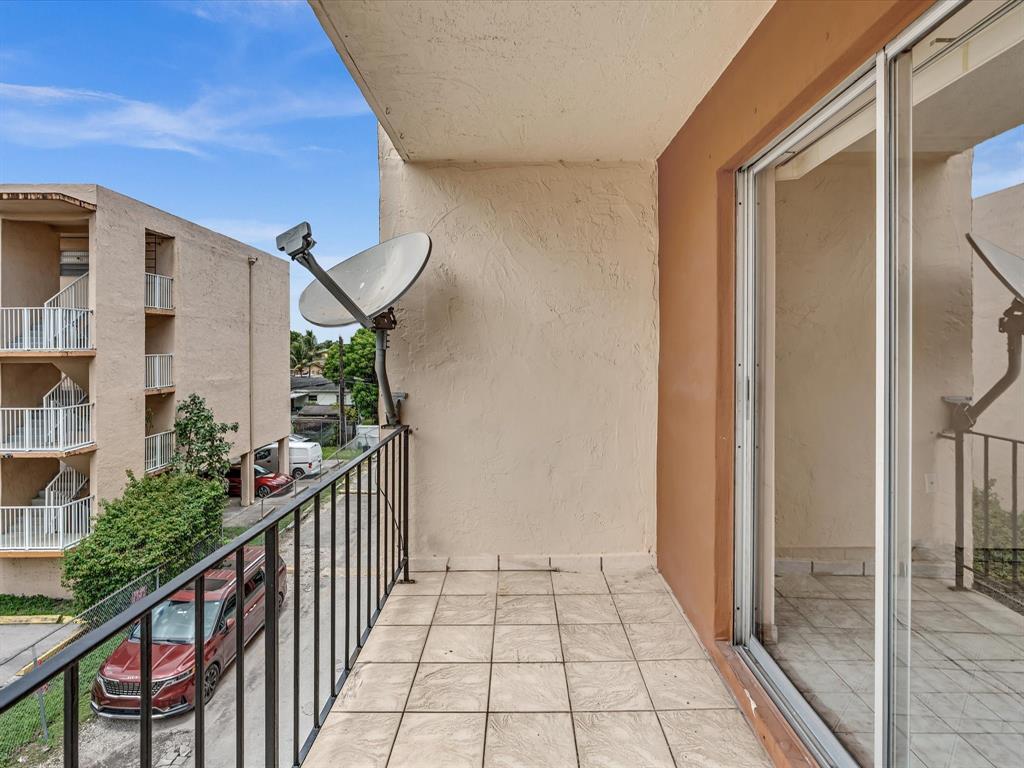 1075 West 68th Street, Unit 203 Hialeah, FL 33014 - Photo 24 of 41 a view of a balcony