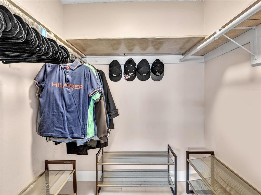 1075 West 68th Street, Unit 203 Hialeah, FL 33014 - Photo 28 of 41 a view of walk in closet with clothes and shoes