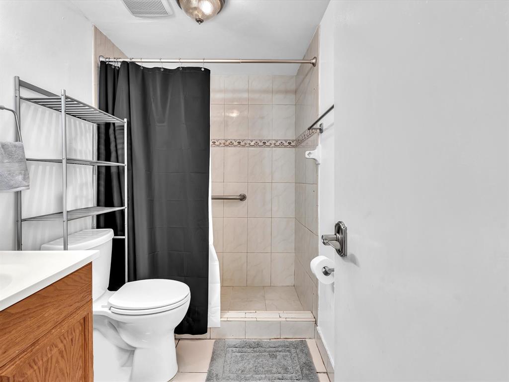 1075 West 68th Street, Unit 203 Hialeah, FL 33014 - Photo 31 of 41 a bathroom with a shower toilet and sink