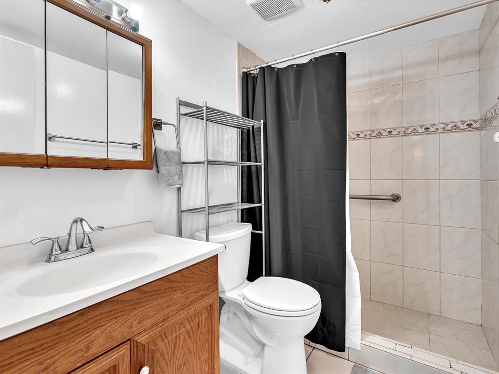 1075 West 68th Street, Unit 203 Hialeah, FL 33014 - Photo 32 of 41 a bathroom with a sink a toilet and shower