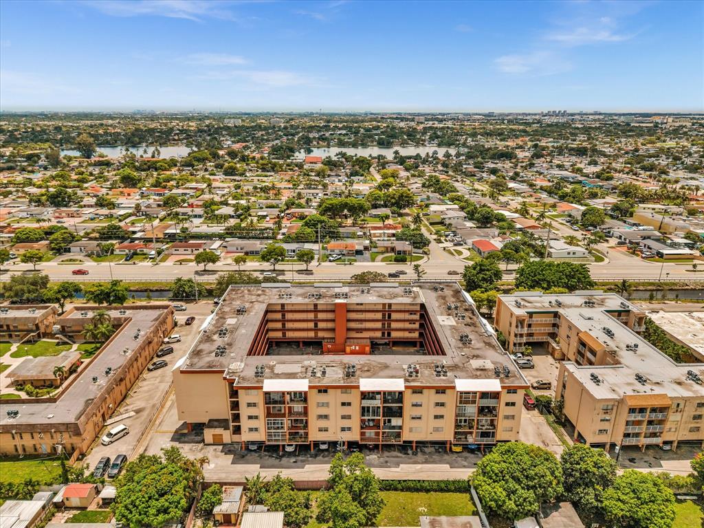 1075 West 68th Street, Unit 203 Hialeah, FL 33014 - Photo 38 of 41 an aerial view of residential building with parking space
