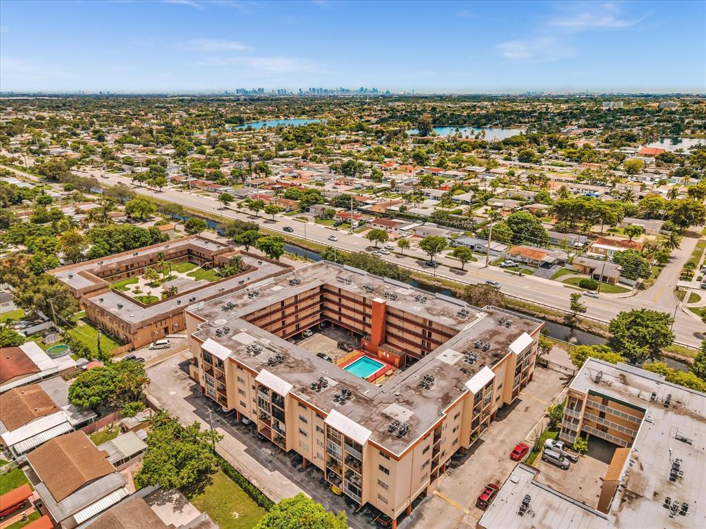 1075 West 68th Street, Unit 203 Hialeah, FL 33014 - Photo 39 of 41 an aerial view of residential building and ocean