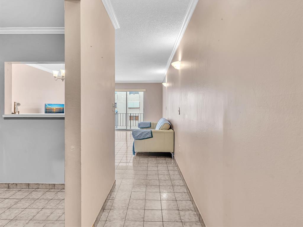 1075 West 68th Street, Unit 203 Hialeah, FL 33014 - Photo 4 of 41 a view of living room with a couch