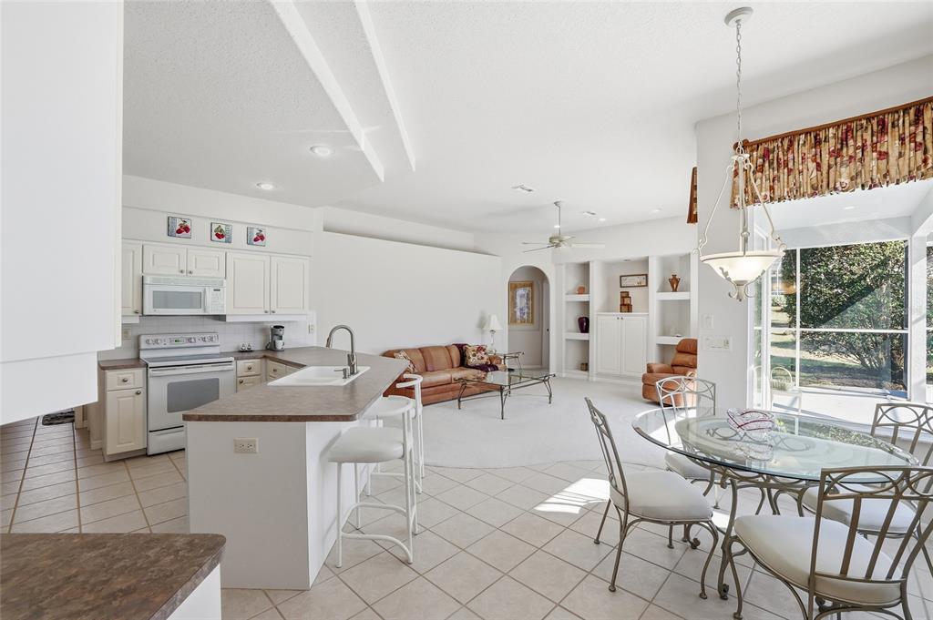 3521 Conifer Loop Spring Hill, FL 34609 - Photo 15 of 71 a view of a dining room with furniture