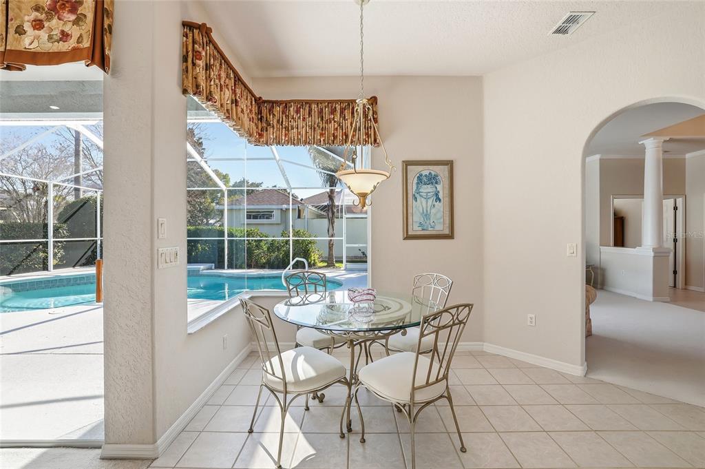 3521 Conifer Loop Spring Hill, FL 34609 - Photo 17 of 71 a dining room with furniture and window
