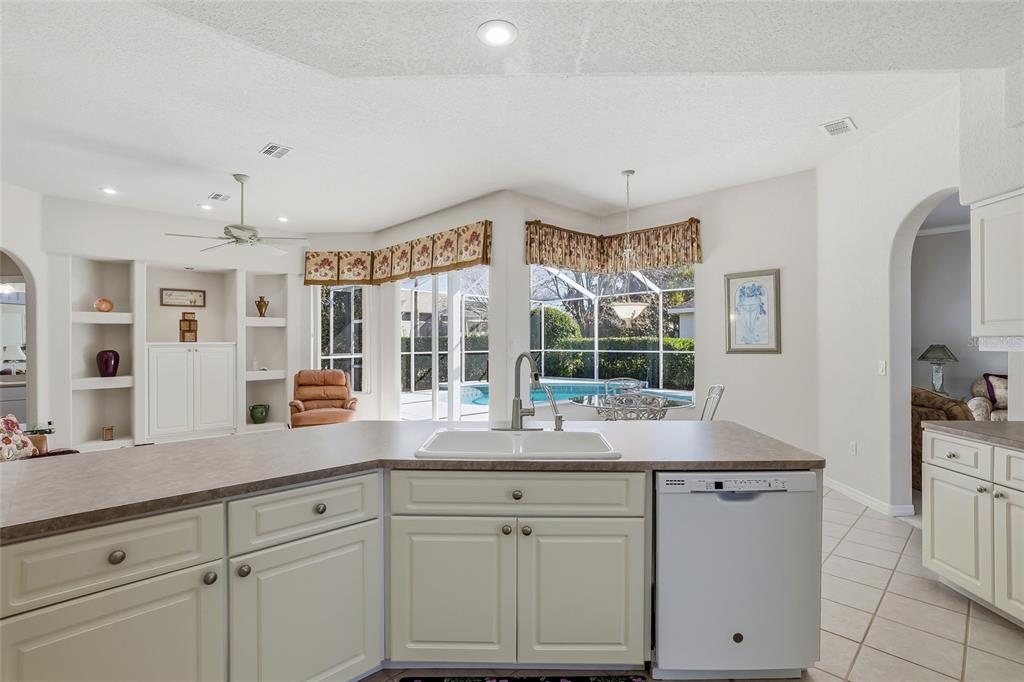 3521 Conifer Loop Spring Hill, FL 34609 - Photo 21 of 71 a kitchen with cabinets window and stainless steel appliances