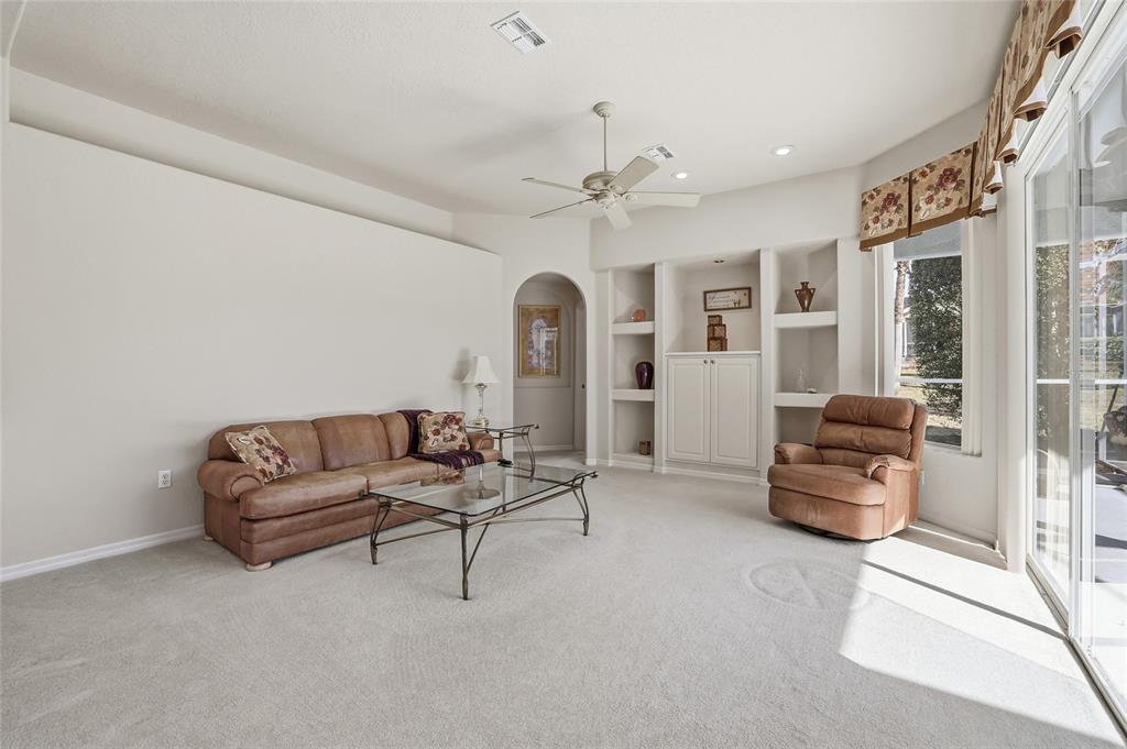 3521 Conifer Loop Spring Hill, FL 34609 - Photo 26 of 71 a living room with furniture and a large window