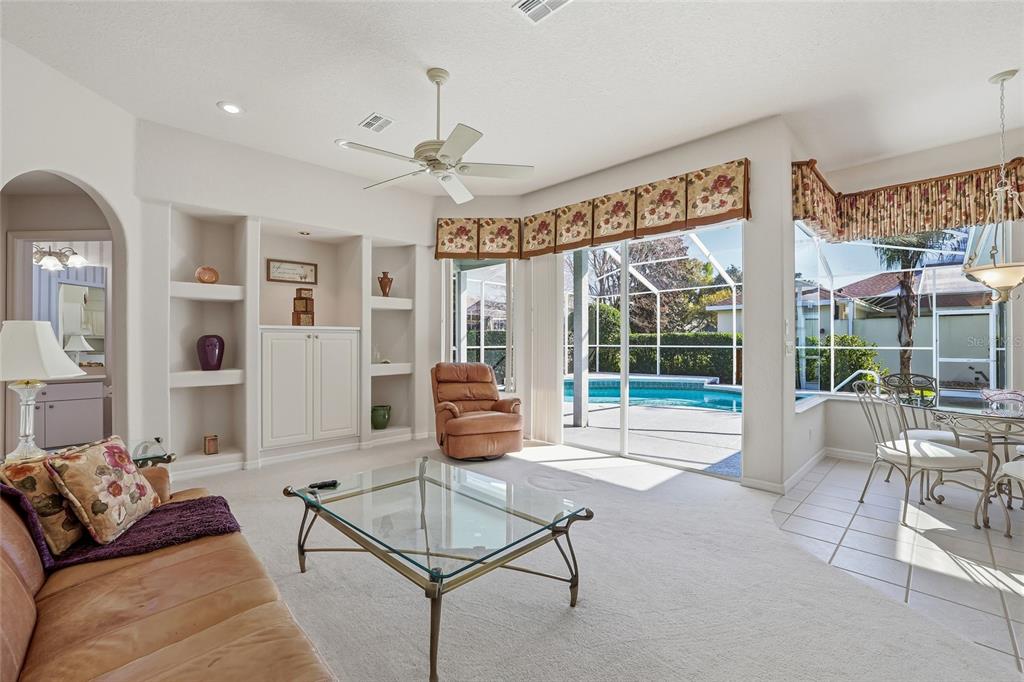 3521 Conifer Loop Spring Hill, FL 34609 - Photo 27 of 71 a living room with furniture and a large window