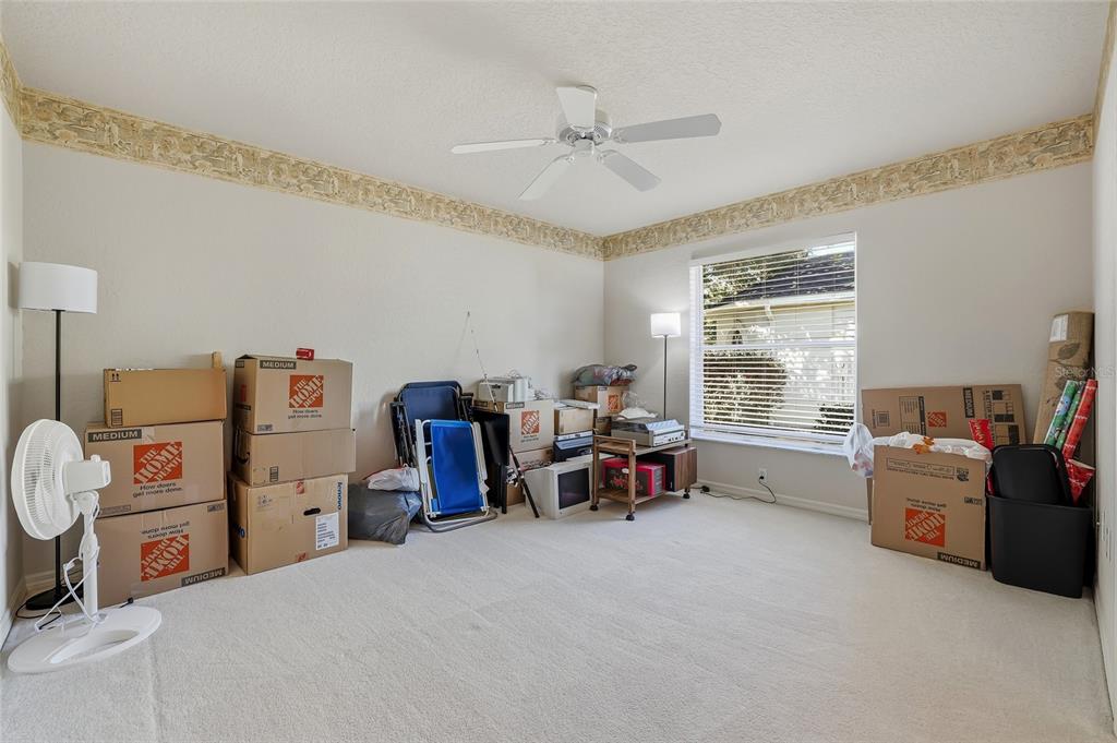 3521 Conifer Loop Spring Hill, FL 34609 - Photo 42 of 71 a view of a workspace with furniture and a window