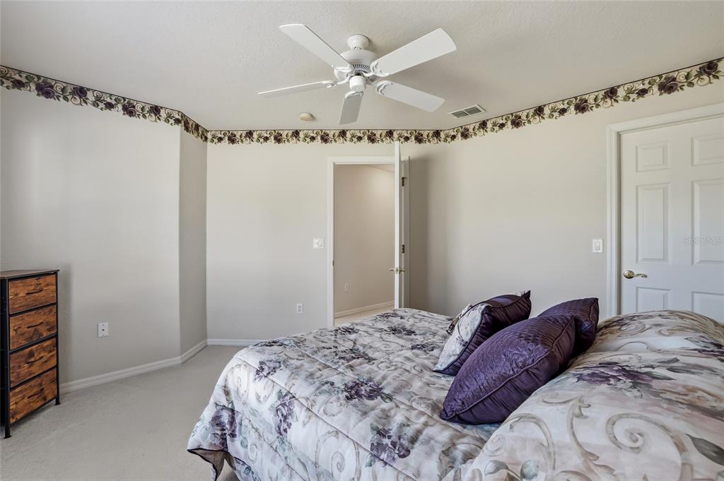3521 Conifer Loop Spring Hill, FL 34609 - Photo 45 of 71 a bedroom with a bed and a window