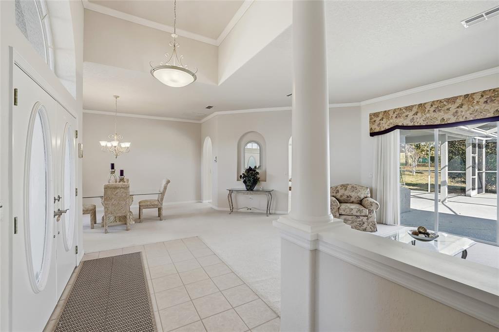 3521 Conifer Loop Spring Hill, FL 34609 - Photo 9 of 71 a living room with furniture and a chandelier