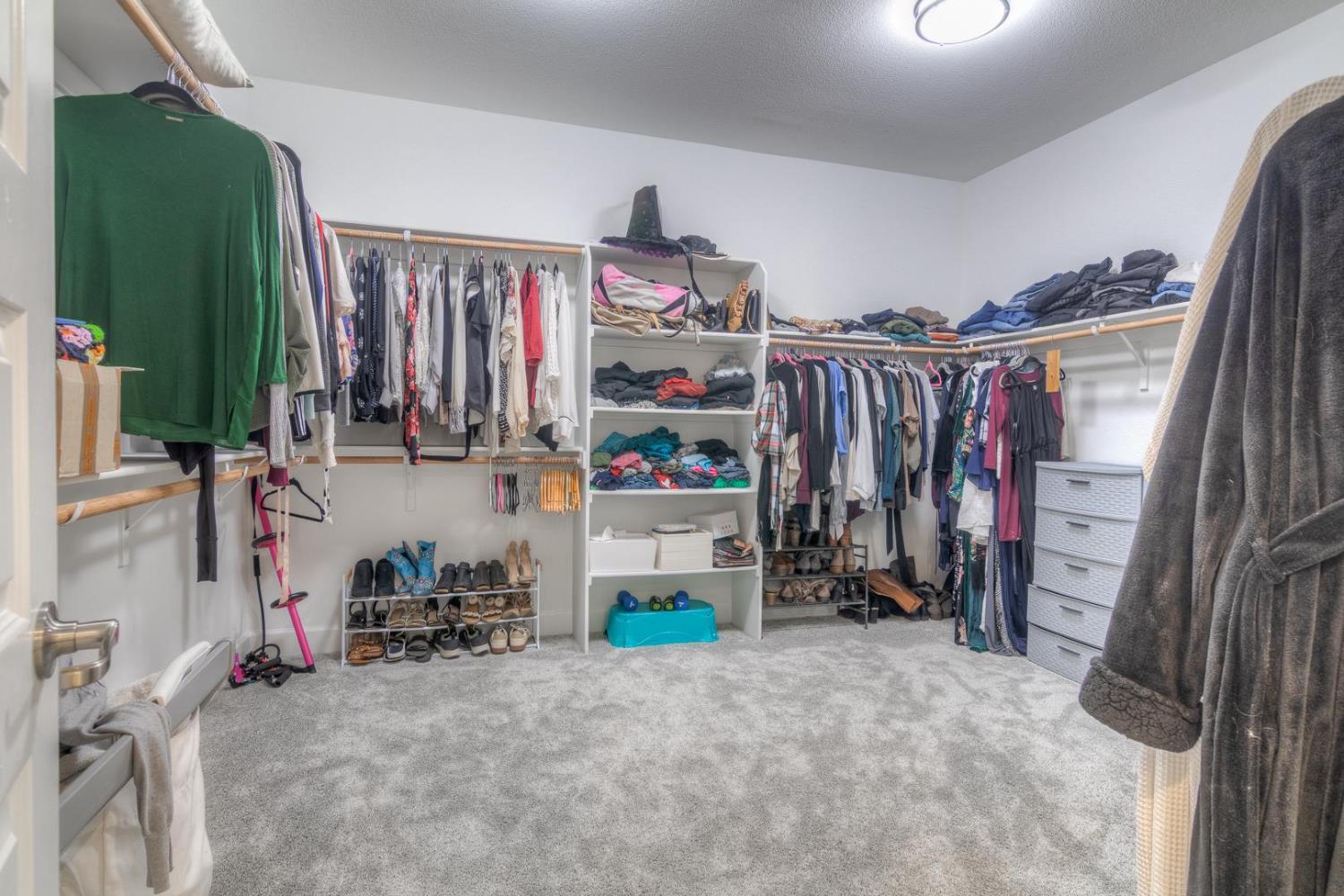 2116 Abbeyhill Road Lincoln, CA 95648 - Photo 36 of 46 a view of walk in closet with clothes and shoes