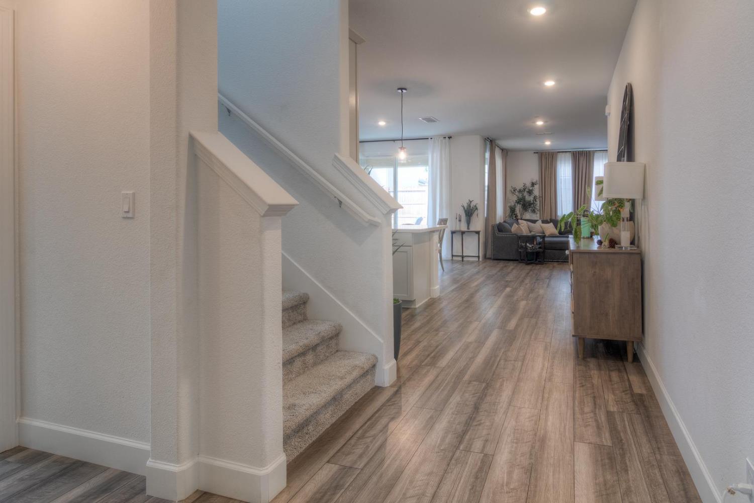 2116 Abbeyhill Road Lincoln, CA 95648 - Photo 6 of 46 a view of a living room and entryway with wooden floor