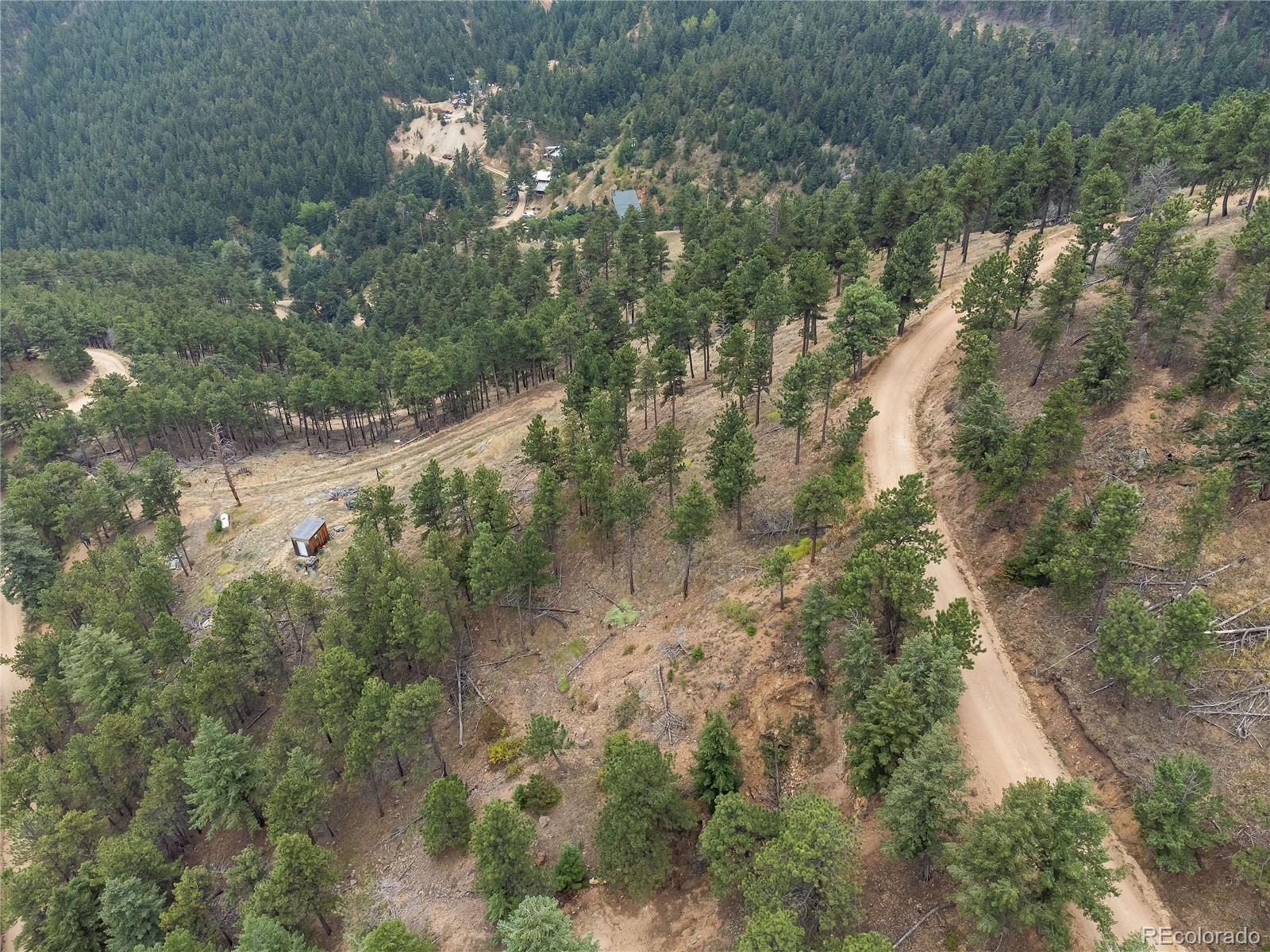 601 Escape Route Boulder, CO 80302 - Photo 14 of 17 a view of a house with a yard