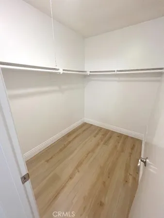 a view of an empty walk in closet