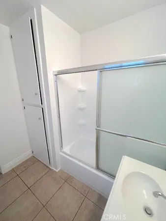 a bathroom with a tub and shower