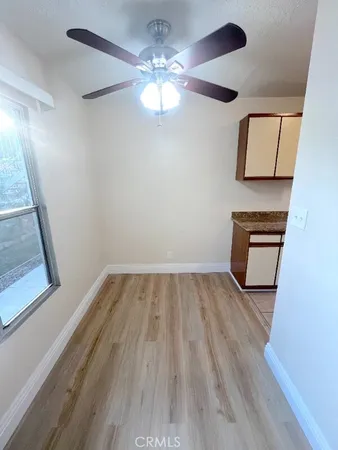 a view of a room with wooden floor and staircase